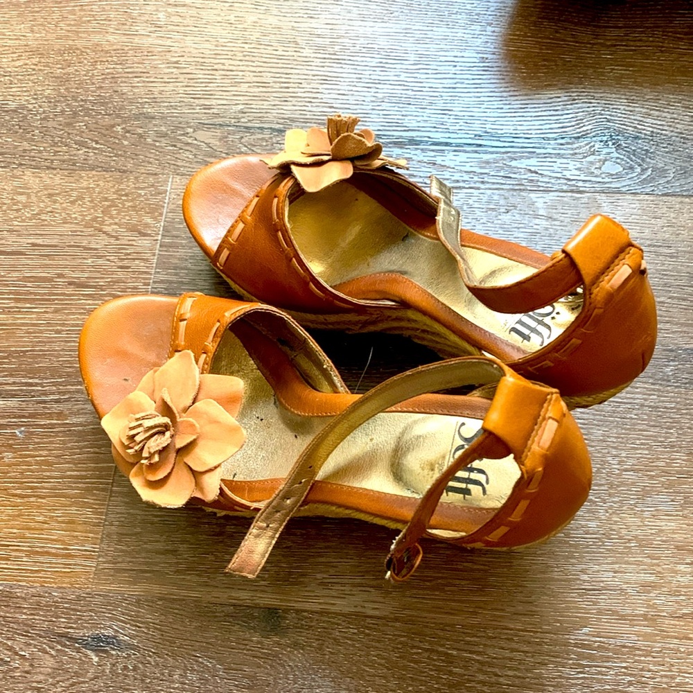 Sofft brand wedge sandals with leather flower detail and woven heel.